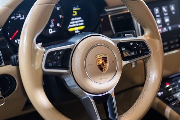 the interior of a car with a steering wheel and dashboard